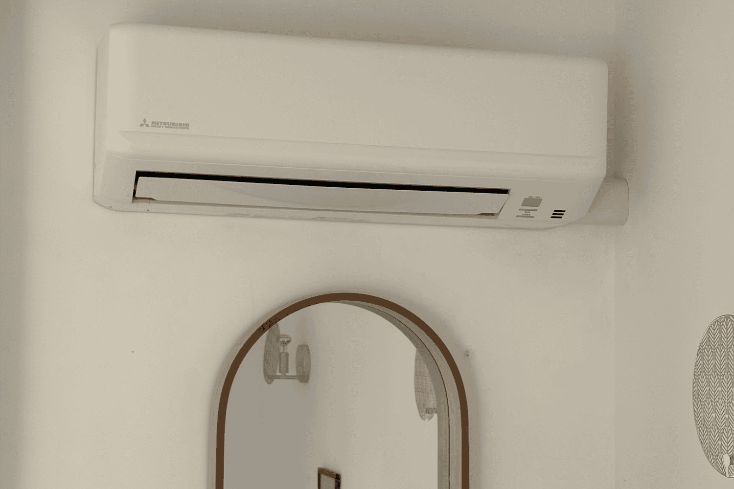 Compact wall mounted unit providing heating and cooling