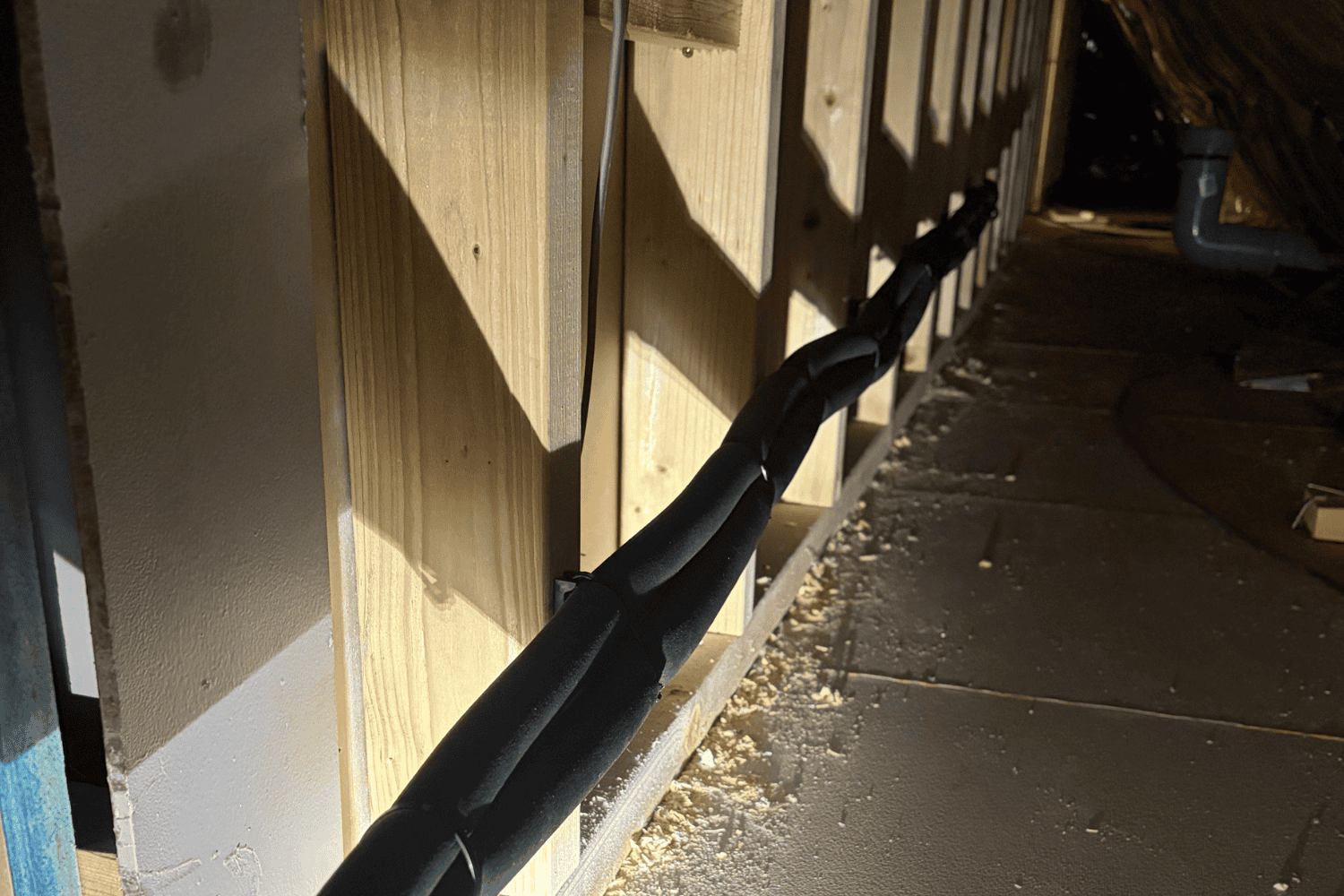 Hidden pipework behind wall for loft air conditioning